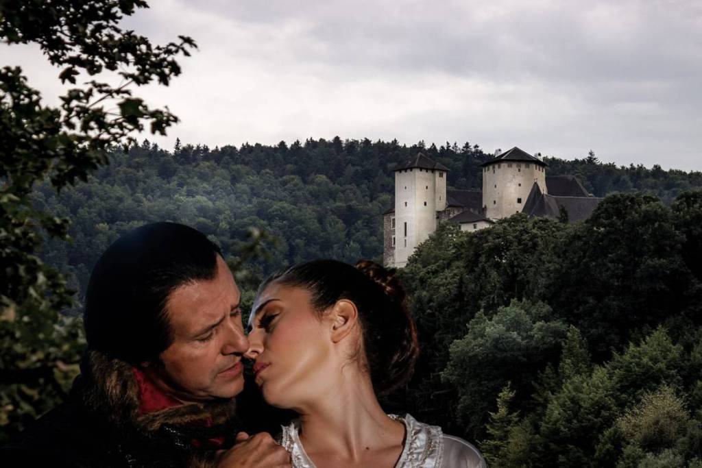 Count Dracula leans over a woman’s neck, while the historic Lockenhaus Castle in the densely forested Burgenland region can be seen in the background.